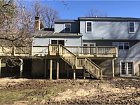 <b>Large Pressure Treated Wood Deck with Wood Railing and Standard Balusters</b>